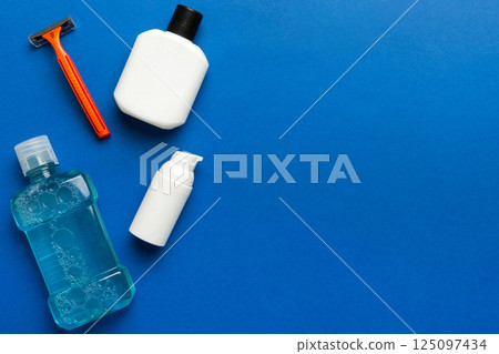 Composition with bath cosmetics on table. razor, toothpaste, soap, gel, toothbrush, mouthwash and other various accessories. Cosmetics for skin health. Bath Mockup for your logo Composition with bath cosmetics on table. razor, toothpaste, soap, gel, toothbrush, mouthwash and other various accessories. Cosmetics for skin health. Bath Mockup for your logo 125097434