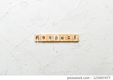 respect word written on wood block. respect text on table, concept respect word written on wood block. respect text on table, concept 125097477
