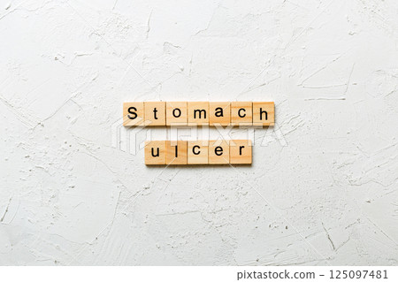 stomach ulcer word written on wood block. stomach ulcer text on table, concept stomach ulcer word written on wood block. stomach ulcer text on table, concept 125097481