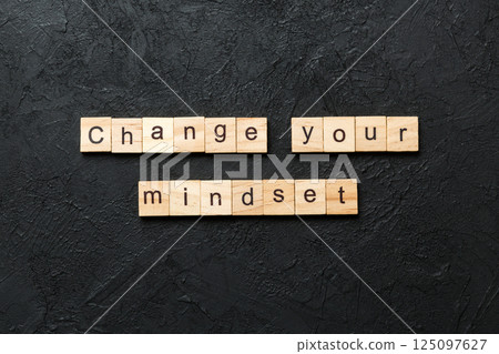 Change your mindset word written on wood block. Change your mindset text on cement table for your desing, Top view concept Change your mindset word written on wood block. Change your mindset text on cement table for your desing, Top view concept 125097627