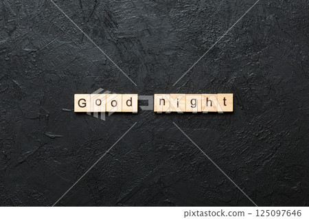 good night word written on wood block. good night text on table, concept good night word written on wood block. good night text on table, concept 125097646