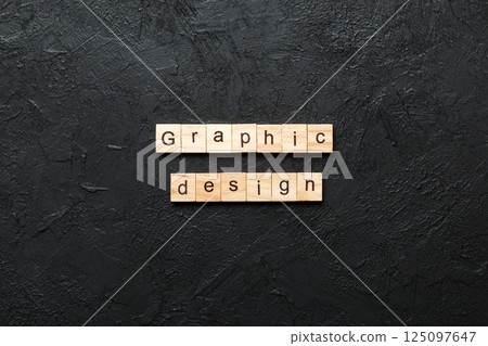 graphic design word written on wood block. graphic design text on cement table for your desing, concept 125097647