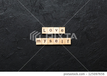 Love myself word written on wood block. Love myself text on cement table for your desing, Top view concept 125097656