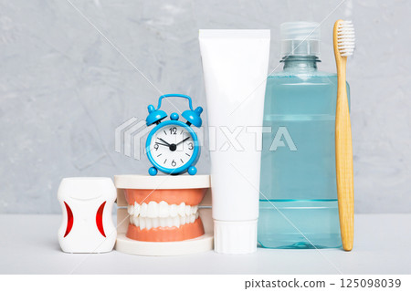 Mouthwash and other oral hygiene products on colored table top view with copy space. Flat lay. Dental hygiene. Oral care kit. Dentist concept 125098039