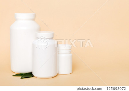 supplement pills with medicine bottle health care and medical top view. Vitamin tablets. Top view mockup bottle for pills and vitamins with green leaves, natural organic bio supplement, copy space supplement pills with medicine bottle health care and medical top view. Vitamin tablets. Top view mockup bottle for pills and vitamins with green leaves, natural organic bio supplement, copy space 125098072