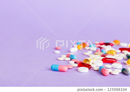 Many different colorful medication and pills perspective view. Set of many pills on colored background Many different colorful medication and pills perspective view. Set of many pills on colored background 125098104