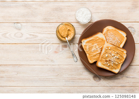 Peanut butter sandwiches or toasts on light table background.Breakfast. Vegetarian food. American cuisine top view vith copy space Peanut butter sandwiches or toasts on light table background.Breakfast. Vegetarian food. American cuisine top view vith copy space 125098148