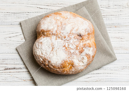 Fresh homemade crisp round bread on napkin, top view. Healthy unleavened bread. French bread. Top view Bakery products Fresh homemade crisp round bread on napkin, top view. Healthy unleavened bread. French bread. Top view Bakery products 125098168