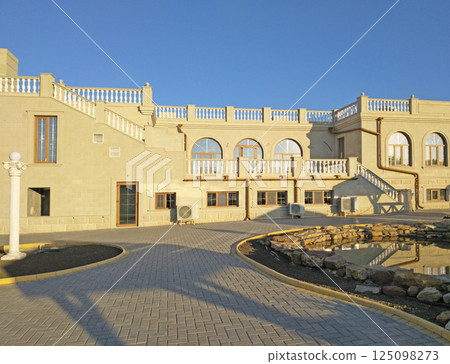the facade of the restaurant and a small pedestrian alley 125098273