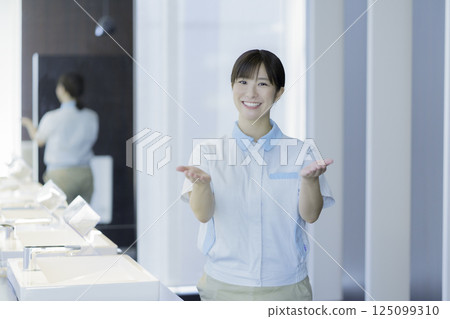 Portrait of a young female office building cleaner. Photo courtesy of Tokyo Electronics College, Denpa Gakuen Corporation. 125099310