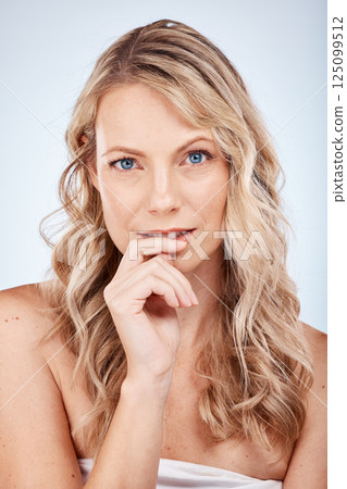 Face portrait, beauty skincare and woman in studio on a blue background. Luxury makeup, natural cosmetics and aesthetics of female model from Canada thinking about facial health and skin wellness. 125099512