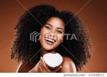 Black woman, coconut and beauty cosmetics makeup or natural skincare wellness. Luxury skin nutrition, healthy facial glow and self care, afro and natural or organic hair care health in studio Black woman, coconut and beauty cosmetics makeup or natural skincare wellness. Luxury skin nutrition, healthy facial glow and self care, afro and natural or organic hair care health in studio 125099513