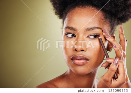Beauty, fashion and black woman apply eyeliner in studio advertising beauty products for face. Skincare, style and beautiful girl using designer makeup products, cosmetics and eye pencil on eyes Beauty, fashion and black woman apply eyeliner in studio advertising beauty products for face. Skincare, style and beautiful girl using designer makeup products, cosmetics and eye pencil on eyes 125099553