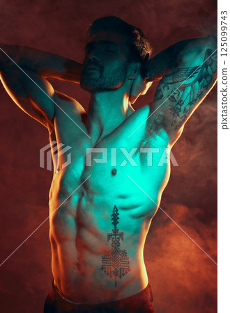 Beauty, fitness and man with smoke in studio with red lighting for workout motivation. Power, strength and strong male model posing for bodybuilding sports, exercise and training with muscular body 125099743