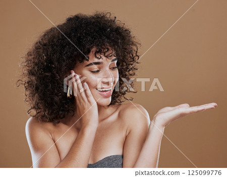 Woman, hand and beauty with advertising space for skincare, wellness and makeup marketing mockup in brown studio background. Model, happy and smile with hands gesture, cosmetics and health skin 125099776