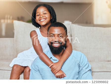 Love, black man father and girl hug, smile and in living room on sofa, with happiness and loving together. Portrait, African American dad and daughter embrace, happy and bonding in lounge on couch. 125099802