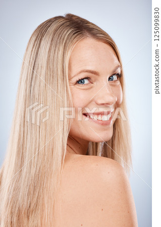 Hair care, smile and portrait of a woman in studio clean, beautiful and long blond hair. Beauty, cosmetic and happy model with keratin, brazilian or salon treatment for hair style by gray background. Hair care, smile and portrait of a woman in studio clean, beautiful and long blond hair. Beauty, cosmetic and happy model with keratin, brazilian or salon treatment for hair style by gray background. 125099830