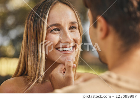Love, man touching woman chin for happiness, intimacy and bonding being loving, happy or smile together. Romance, couple or connect for relationship for quality time, passionate or embrace on holiday 125099997