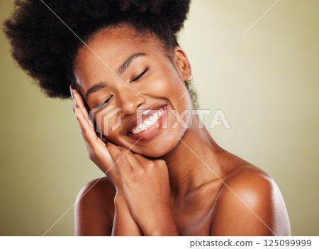 Black woman, hands and smile for facial skincare, makeup or cosmetics against a studio background. African American female smiling in satisfaction for beautiful cosmetic treatment or perfect skin Black woman, hands and smile for facial skincare, makeup or cosmetics against a studio background. African American female smiling in satisfaction for beautiful cosmetic treatment or perfect skin 125099999