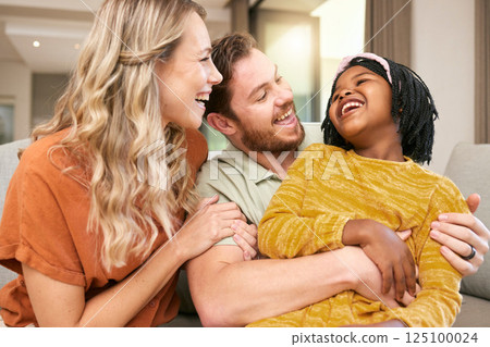 Family, love and hug, laughing and happiness with care and funny, bonding and couple with black child together at family home. Happy family, adoption or foster care and interracial with relationship. 125100024