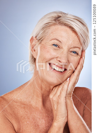 Senior woman, skincare and happy with cosmetics, health and wellness of face beauty against a grey studio background with mockup. Elderly model, portrait and skin makeup, cosmetic and healthy smile 125100089