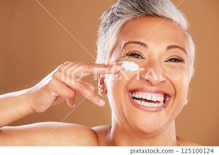 Senior woman, sunscreen and face, skincare and happy smile in studio background. Mockup up for natural beauty, cosmetic products and wellness cream. Facial model for skin, cleaning and moisturizing Senior woman, sunscreen and face, skincare and happy smile in studio background. Mockup up for natural beauty, cosmetic products and wellness cream. Facial model for skin, cleaning and moisturizing 125100124