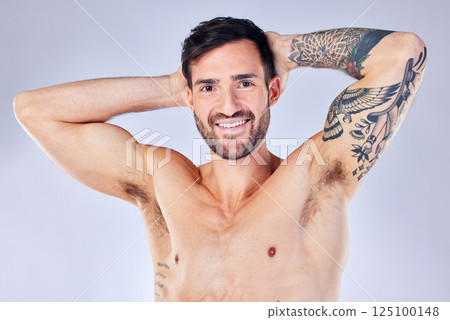 Fitness, health and man with tattoo topless in studio background. Motivation, art and exercise, portrait of happy sports model in studio with smile and tattoos, healthy male model with body care. 125100148