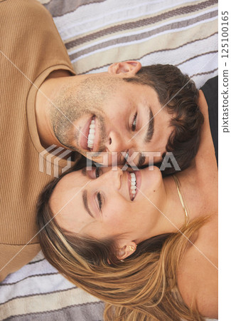 Couple, love and face happy together on relax quality time or marriage romance vacation. Young married man, woman smile and happiness for calm, relaxing lifestyle and intimate romantic relationship 125100165