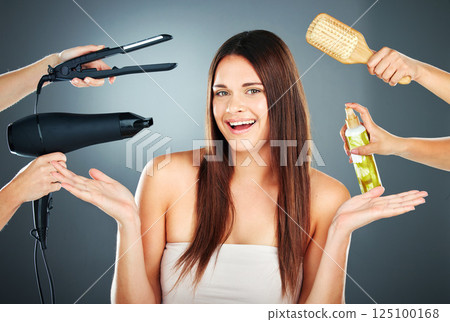 Beauty, hair care and woman in studio for hairdresser and salon choice or decision with hairdryer, hair straightener and tools. Portrait of happy model with mockup hands for self care cosmetics 125100168