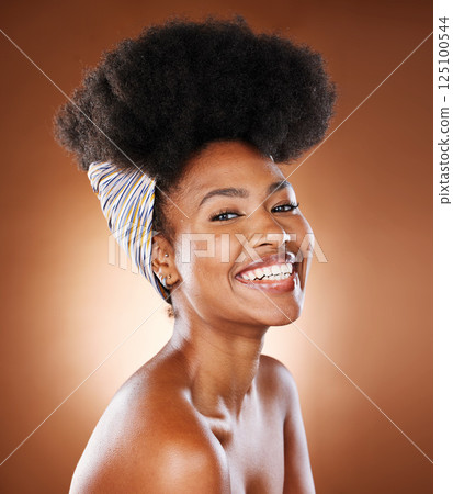 Black woman, afro hair and skincare glow on studio background in healthcare wellness, face dermatology or cosmetology. Portrait, smile or happy beauty model with natural hair, head scarf and makeup Black woman, afro hair and skincare glow on studio background in healthcare wellness, face dermatology or cosmetology. Portrait, smile or happy beauty model with natural hair, head scarf and makeup 125100544