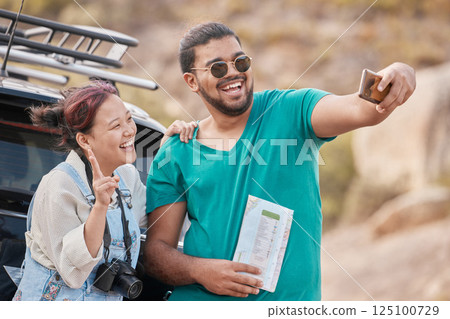 Couple, travel and road trip selfie with peace sign, map and smile while on a stop outdoor for social media streaming on vacation, journey and adventure. Asian, woman and man together for phone photo Couple, travel and road trip selfie with peace sign, map and smile while on a stop outdoor for social media streaming on vacation, journey and adventure. Asian, woman and man together for phone photo 125100729