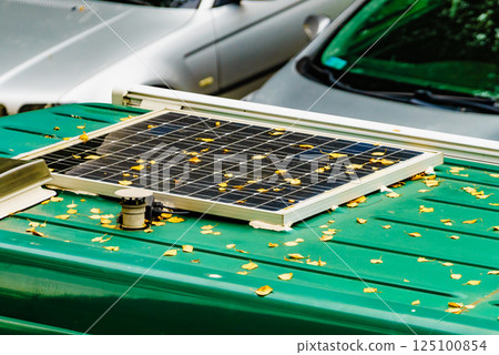 Camper van with solar panel on roof 125100854