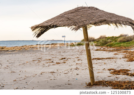 Shelter on beach. Cloudy weather Shelter on beach. Cloudy weather 125100873
