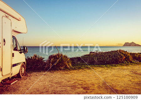 Caravan on spanish coast, Gibraltar rock on horizon 125100909
