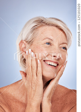 Skincare, thinking and senior face of woman with smile for natural cosmetic, wellness and dermatology treatment. Wrinkles, happiness and mature model touching skin with self love in gray studio. Skincare, thinking and senior face of woman with smile for natural cosmetic, wellness and dermatology treatment. Wrinkles, happiness and mature model touching skin with self love in gray studio. 125101020