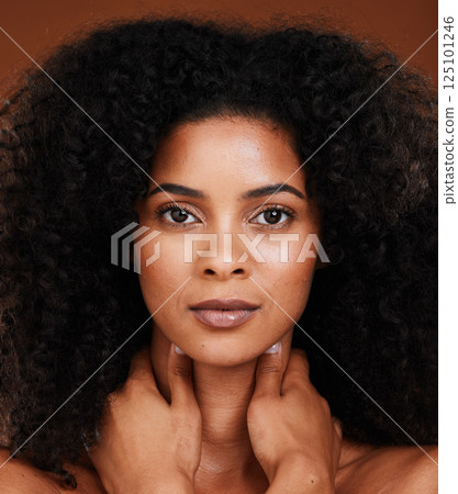 Skincare, beauty and portrait of a black woman in a studio for a natural, organic and healthy skin treatment. Health, wellness and headshot of African woman with a facial routine by brown background. Skincare, beauty and portrait of a black woman in a studio for a natural, organic and healthy skin treatment. Health, wellness and headshot of African woman with a facial routine by brown background. 125101246