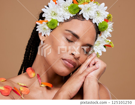 Beauty, skincare and flowers in hair of black woman for natural, spring and luxury cosmetics. Wellness, relax and makeup with face of girl model for self love, fresh and creative in studio background Beauty, skincare and flowers in hair of black woman for natural, spring and luxury cosmetics. Wellness, relax and makeup with face of girl model for self love, fresh and creative in studio background 125101250