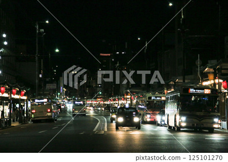 Cars and city buses passing by in Gion, Kyoto at night Cars and city buses passing by in Gion, Kyoto at night 125101270