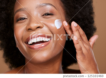 Skincare, face cream and woman in studio for wellness, beauty and cleaning against brown background. Portrait, black woman and sunscreen product on face for luxury, facial and dermatology with mockup 125101460