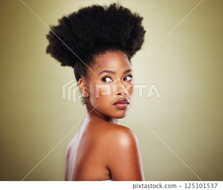 African, cosmetics and black woman with a glow from skincare, dermatology and cosmetology against a green studio background. Afro hair, makeup and face of a model thinking of beauty and body wellness 125101537