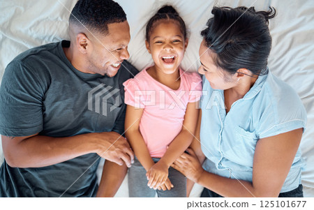Happy family, top view and tickle kid in bedroom for love, care or relax in family home. Above of laughing, smile and playful parents, excited girl child and happiness of funny time together in house Happy family, top view and tickle kid in bedroom for love, care or relax in family home. Above of laughing, smile and playful parents, excited girl child and happiness of funny time together in house 125101677