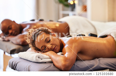 Back massage, spa stone and relax couple in luxury wellness for zen therapy, beauty and skincare. Calm, peace and sleeping people on salon bed for healthy stress relief or happy holistic body detox Back massage, spa stone and relax couple in luxury wellness for zen therapy, beauty and skincare. Calm, peace and sleeping people on salon bed for healthy stress relief or happy holistic body detox 125101680