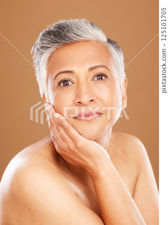 Skincare, wellness and portrait of senior black woman isolated in studio on orange background. Beauty, cosmetics and old female pose for anti aging beauty products, skincare products and body care Skincare, wellness and portrait of senior black woman isolated in studio on orange background. Beauty, cosmetics and old female pose for anti aging beauty products, skincare products and body care 125101705
