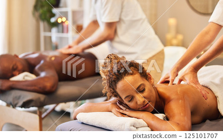 Massage, spa and wellness with couple and massage therapist for therapy and stress relief, relax and peace together. Body care, luxury and holistic health with hands for back massage and zen. 125101707