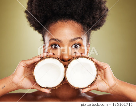 Skincare, beauty and portrait of black woman with coconut in studio on brown background. Wellness, body care and eyes of girl with fruit for healthy, organic and natural cosmetic products and makeup 125101715