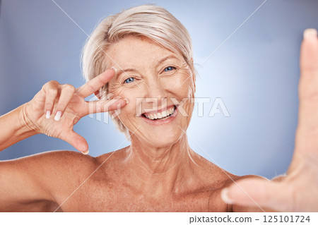 Mature woman, peace sign or face selfie on studio background in wellness health success, dermatology progress or fun self love. Portrait, happy smile or skincare beauty model in cool hand gesture pov 125101724