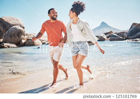Black couple, beach and running while happy on vacation in summer with energy, love and happiness while outdoor. Man and woman together by the sea for honeymoon, holiday and quality time in nature Black couple, beach and running while happy on vacation in summer with energy, love and happiness while outdoor. Man and woman together by the sea for honeymoon, holiday and quality time in nature 125101769