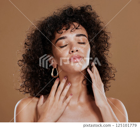 Beauty, skincare and face of black woman in studio on brown background for wellness. Hair care, fashion and young female model with makeup, cosmetics and beauty products with glowing healthy skin Beauty, skincare and face of black woman in studio on brown background for wellness. Hair care, fashion and young female model with makeup, cosmetics and beauty products with glowing healthy skin 125101779