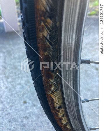 Worn out bicycle tires 125101787