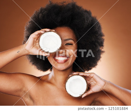 Coconut, studio and black woman natural face, skincare and hair promotion with mockup for healthy food or product marketing. African model portrait with facial cream coconut oil for health benefits 125101884